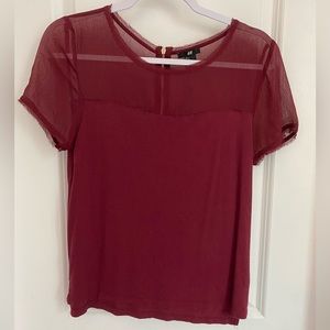 Maroon H&M tee. Sheer detail on top. Side splits. Raw edge detail. Size S.